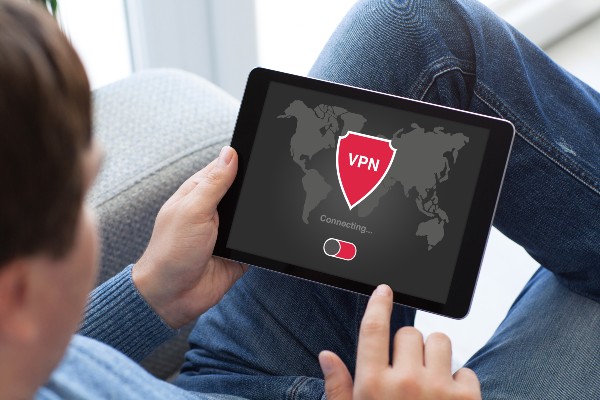 man accessing vpn on a tablet