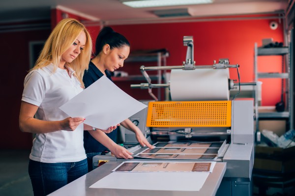 two women using a printer