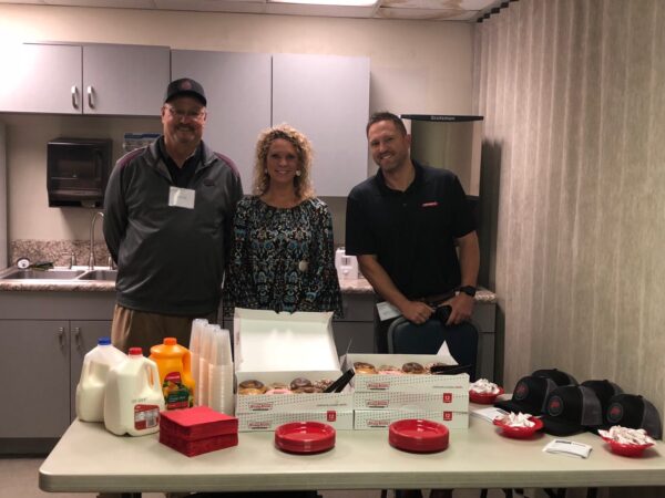 fishers team in kitchen with donuts